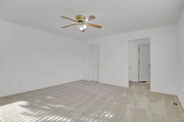 a view of an empty room with a window