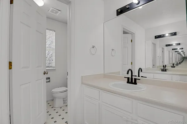 a bathroom with a glass shower door