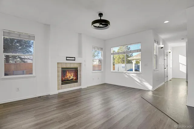 a kitchen with granite countertop a stove sink and microwave