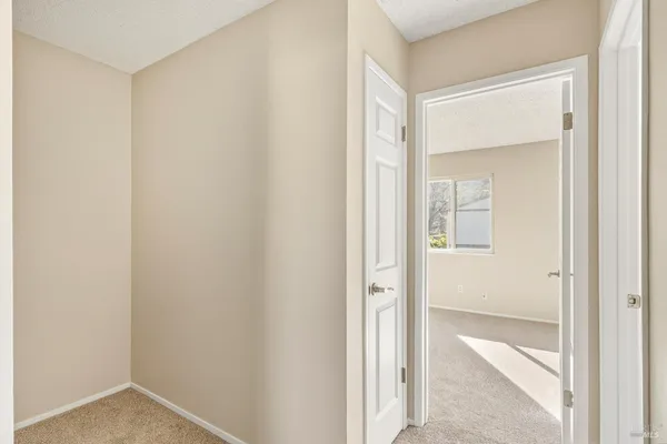 a view of a bathroom from a hallway