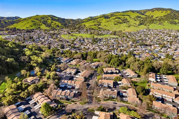 an aerial view of residential houses with outdoor space