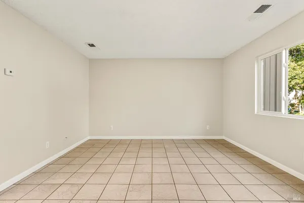 a view of an empty room and window