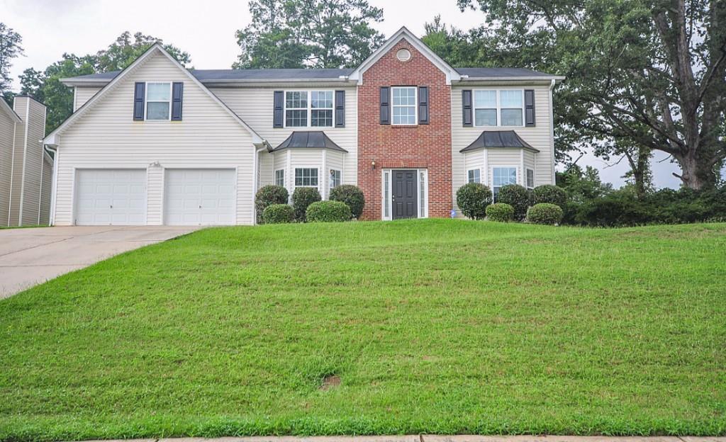 6392 Pisgah Road Southwest Austell, GA 30168 - Photo 1 of 1 a front of a house with a yard