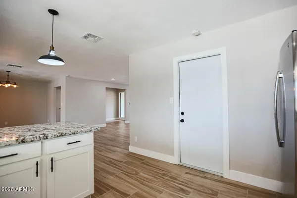 a view of a kitchen cabinets and wooden floor