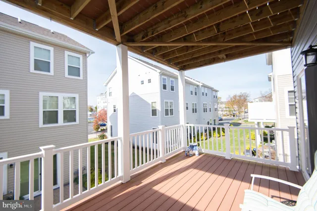 a view of a balcony with wooden floor