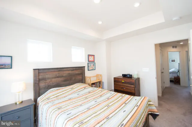 a bedroom with a bed and dresser