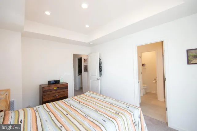 a bedroom with a bed and a television