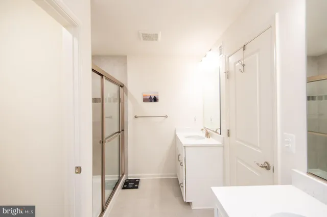 a bathroom with a sink a bath tub and a shower