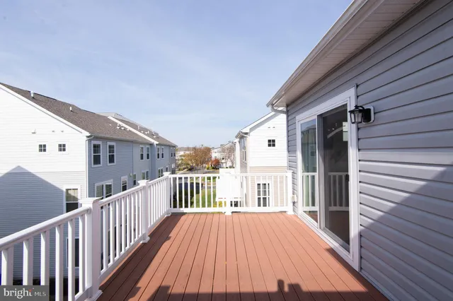 a view of a balcony with wooden floor
