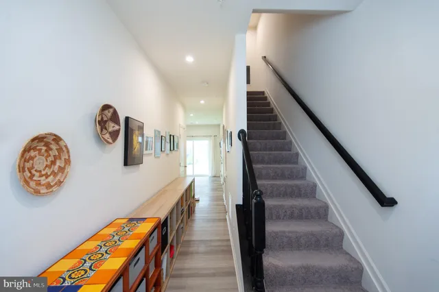 a view of staircase with wooden floor