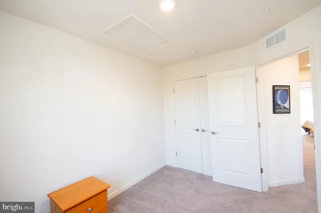 a view of room with walk in closet and window