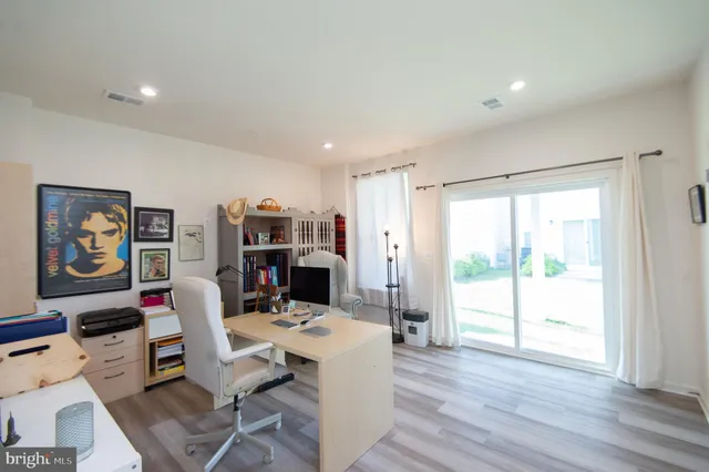 a workspace with furniture hardwood and a window
