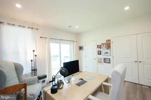 a work room with furniture and wooden floor