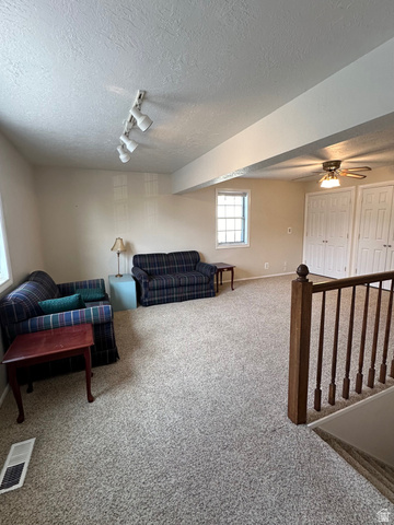 254 Meadow Lane Centerville, UT 84014 - Photo 24 of 34 Spacious room featuring neutral carpeting and light-toned walls