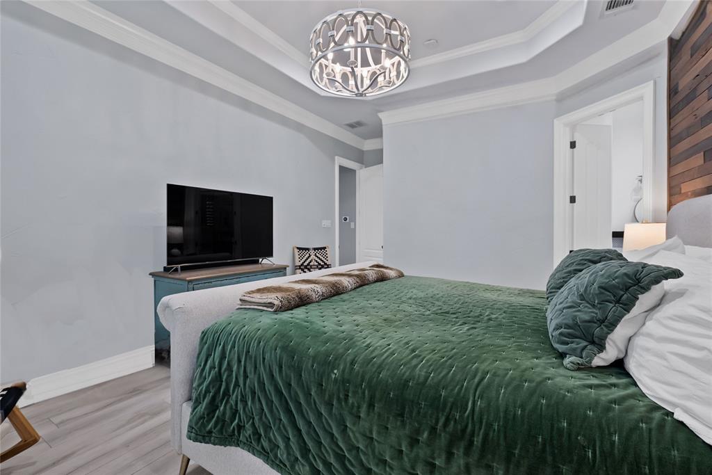 1501 Burleson Retta Road Burleson, TX 76028 - Photo 12 of 40 a bedroom with a bed and a flat screen tv