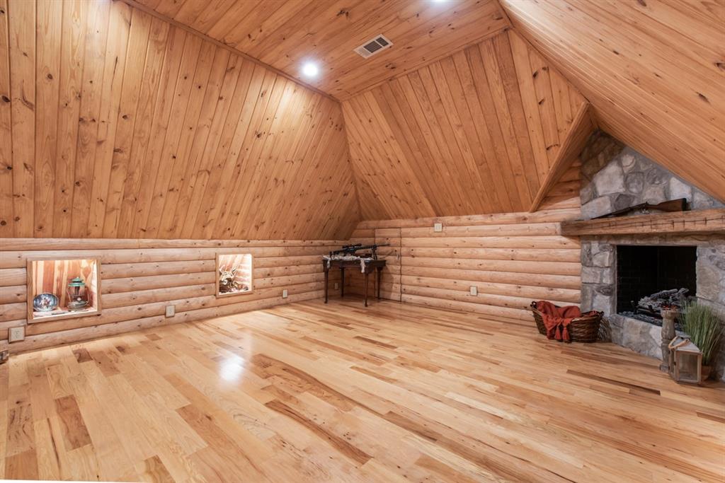 1501 Burleson Retta Road Burleson, TX 76028 - Photo 19 of 40 a view of a patio with table and chairs with wooden floor and fence