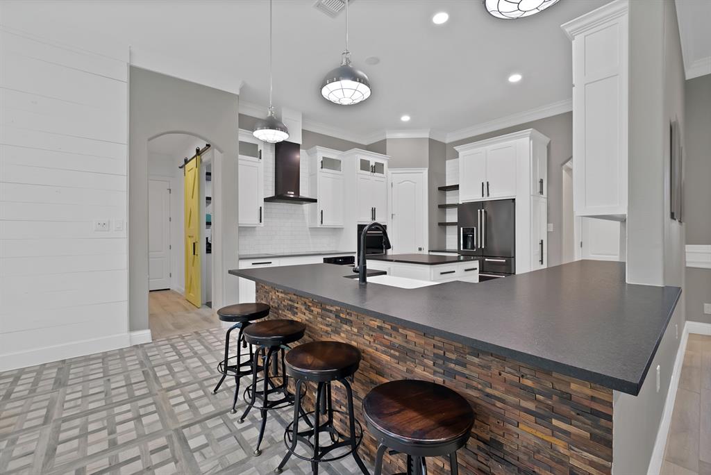 1501 Burleson Retta Road Burleson, TX 76028 - Photo 8 of 40 a kitchen with stainless steel appliances granite countertop a sink a stove and a refrigerator