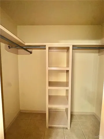 a view of an empty walk in closet