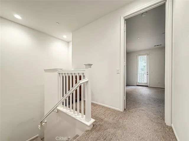 a view of a hallway with entryway and closet