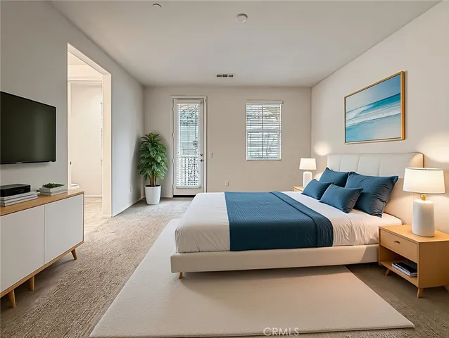 a bedroom with a bed and a flat screen television