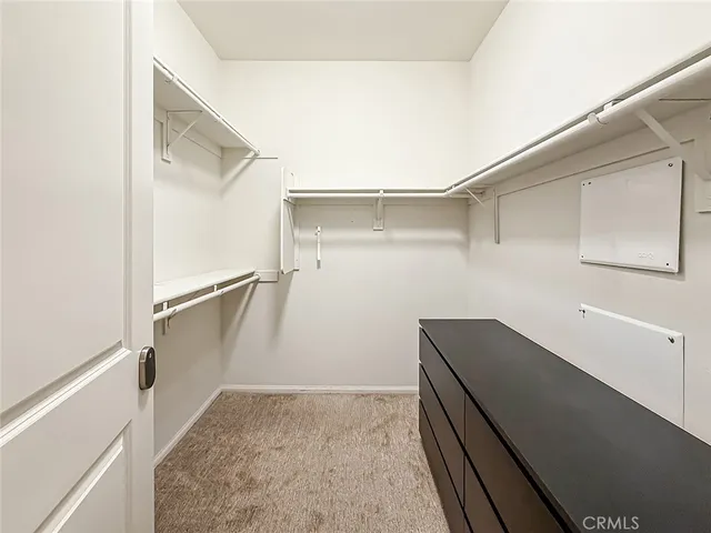 a bathroom with a double vanity sink mirror and shower