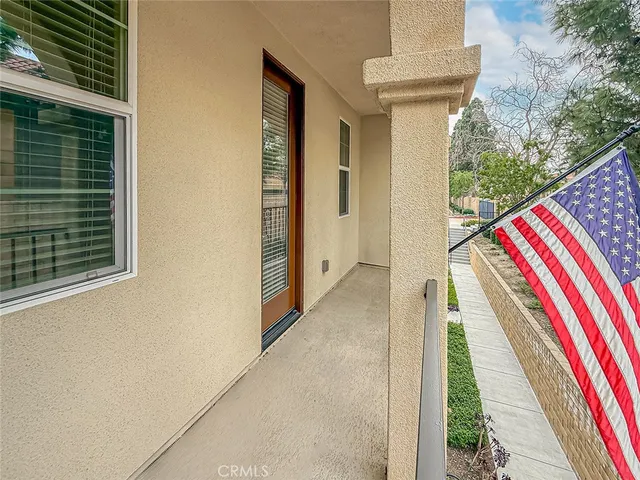 a bedroom with a bed and a potted plant