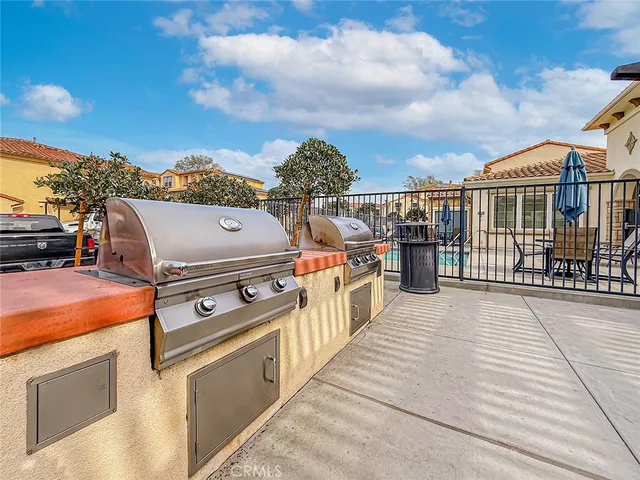 a view of a house with swimming pool and sitting area