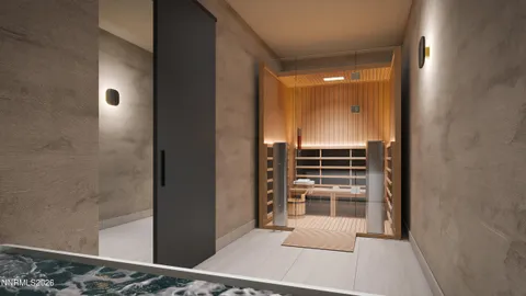a view of a hallway with wooden floor and kitchen