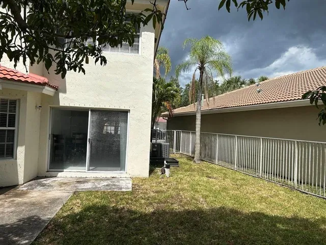 a black and white building with glass windows