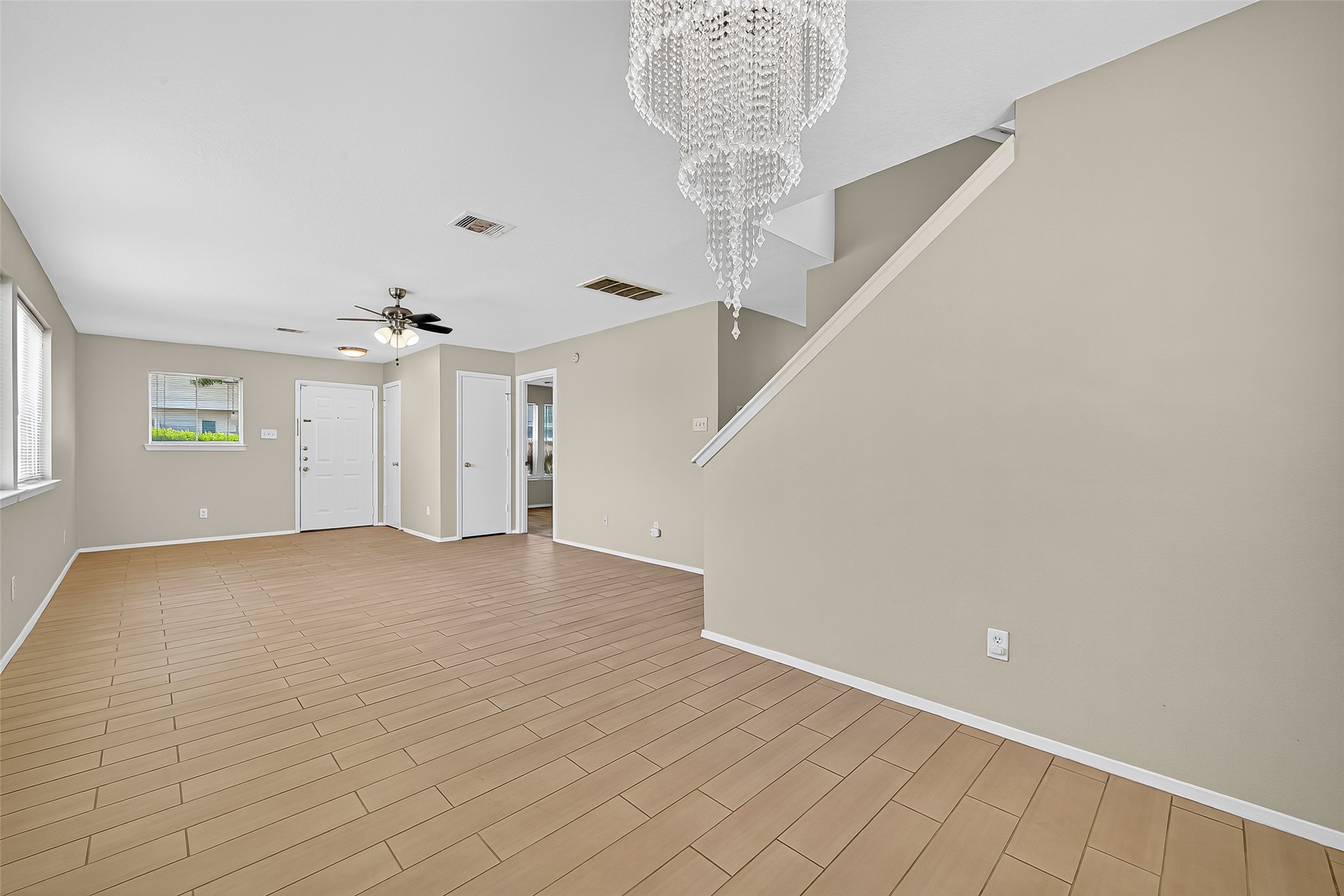6343 Settlers Square Lane Katy, TX 77449 - Photo 15 of 41 a view of an empty room with a chandelier fan