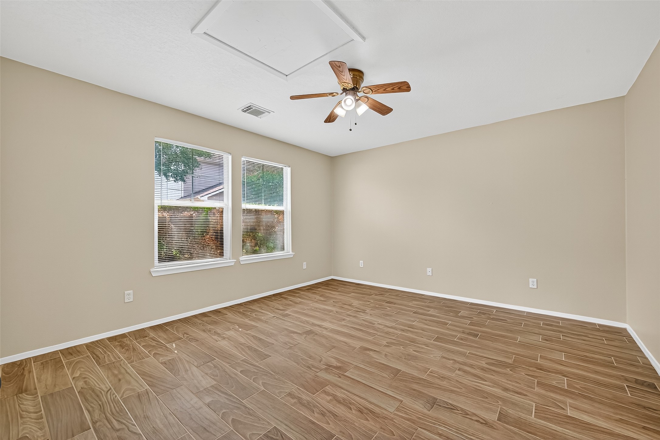 6343 Settlers Square Lane Katy, TX 77449 - Photo 16 of 41 wooden floor in an empty room with a window