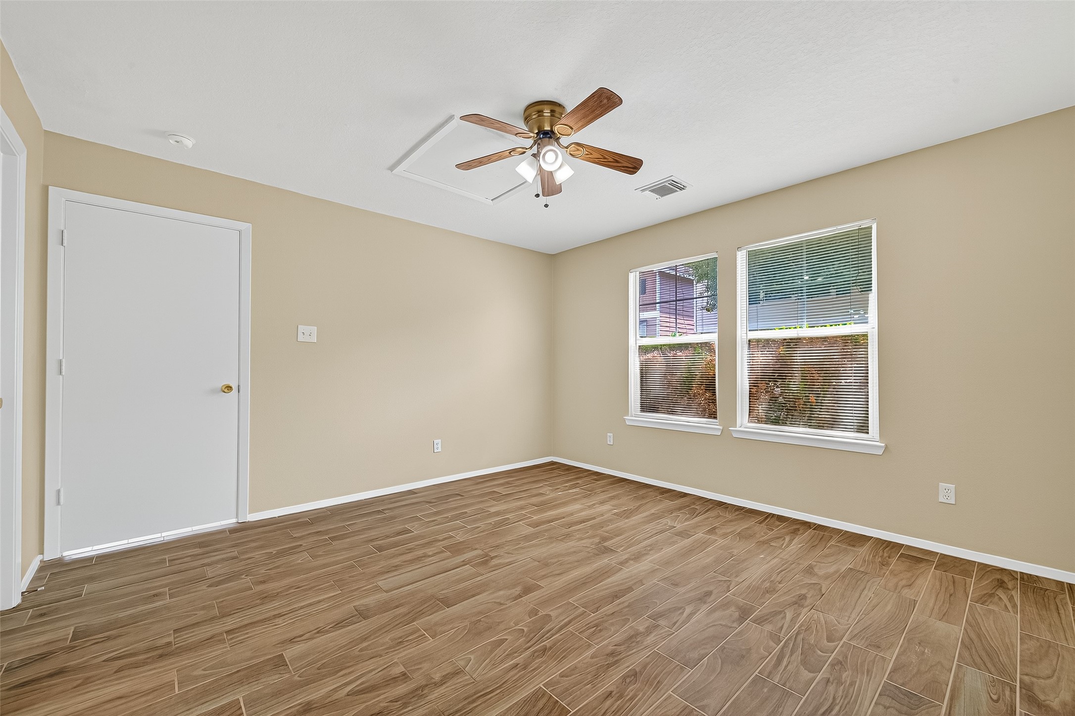 6343 Settlers Square Lane Katy, TX 77449 - Photo 19 of 41 wooden floor in an empty room with a window