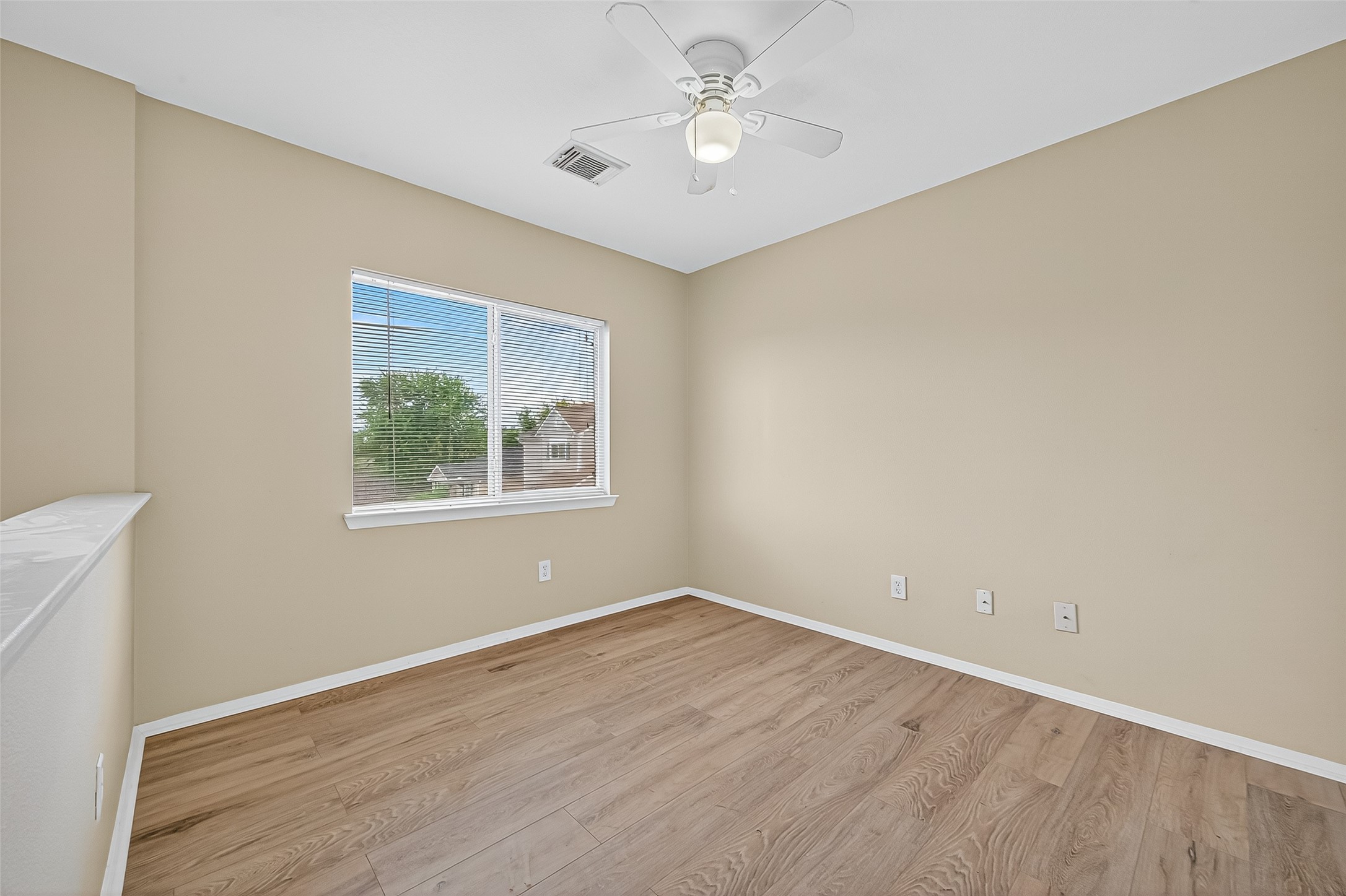 6343 Settlers Square Lane Katy, TX 77449 - Photo 27 of 41 an empty room with a window and a fan