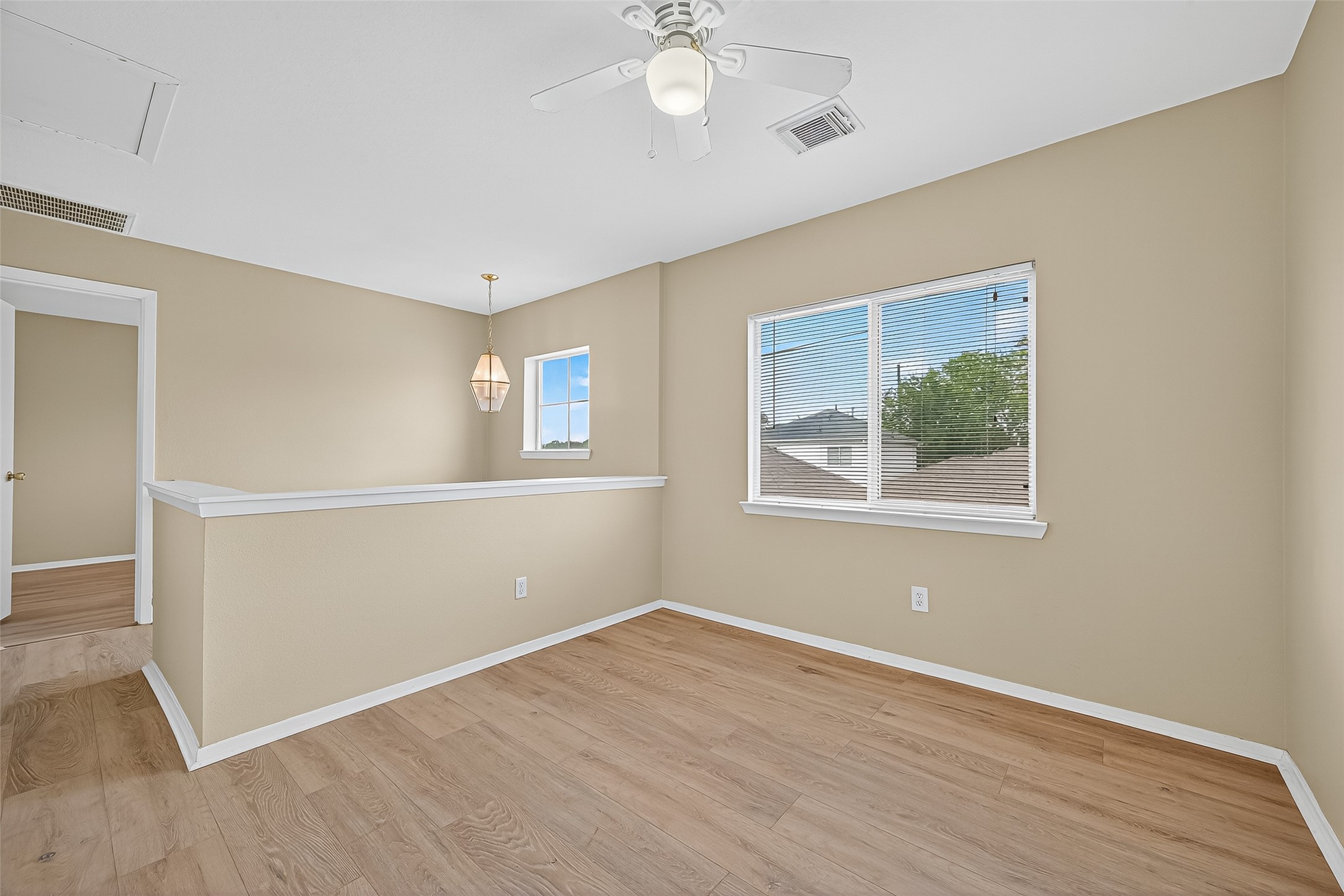 6343 Settlers Square Lane Katy, TX 77449 - Photo 28 of 41 a view of empty room with wooden floor and fan