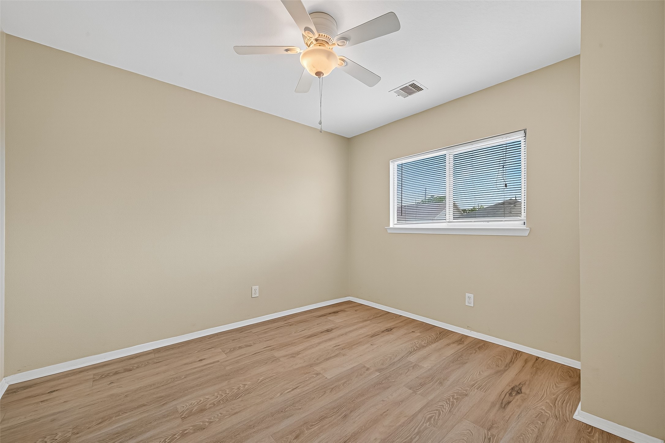 6343 Settlers Square Lane Katy, TX 77449 - Photo 31 of 41 a view of an empty room with window and wooden floor