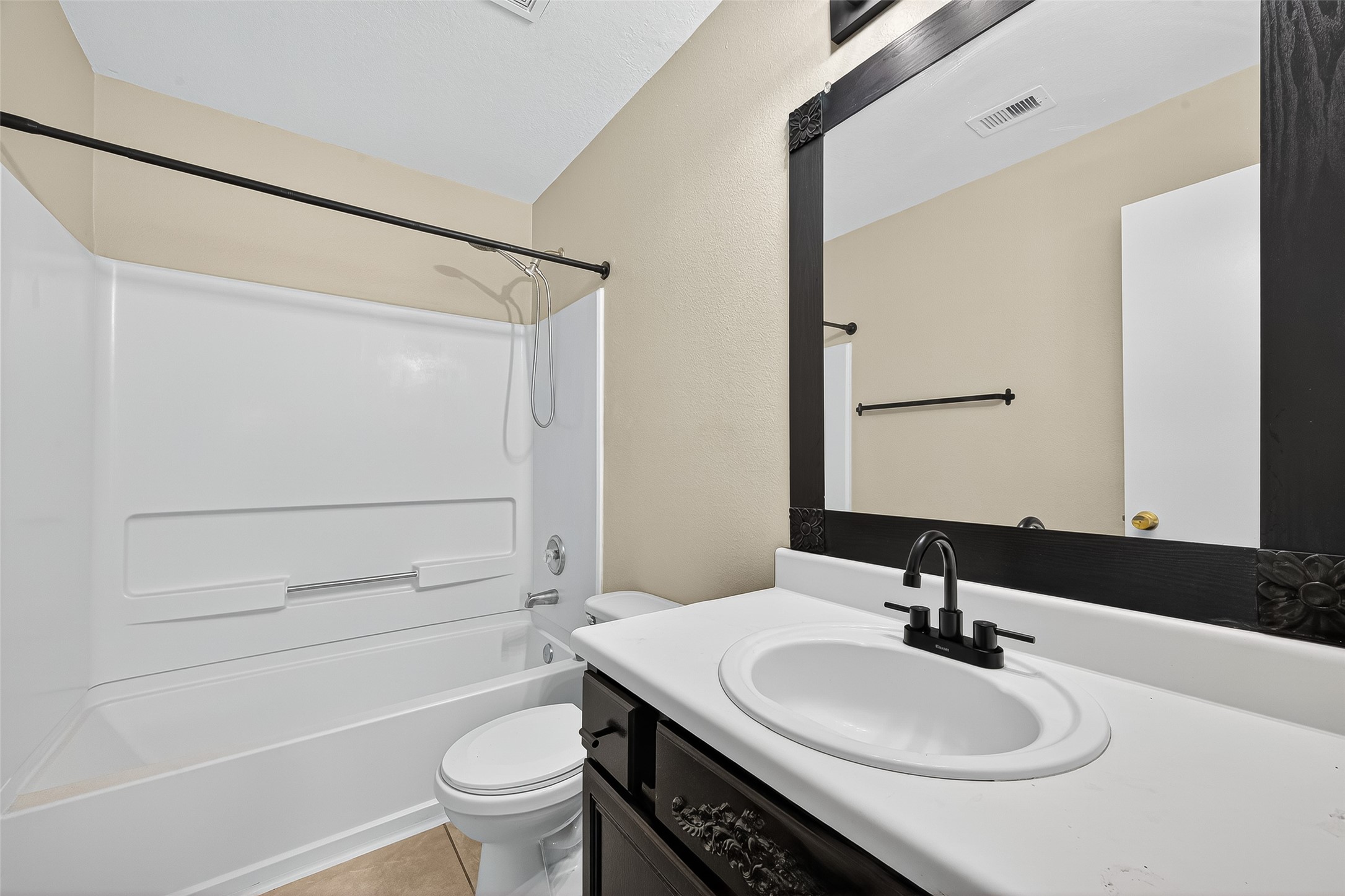 6343 Settlers Square Lane Katy, TX 77449 - Photo 38 of 41 a bathroom with a granite countertop sink toilet a mirror and shower