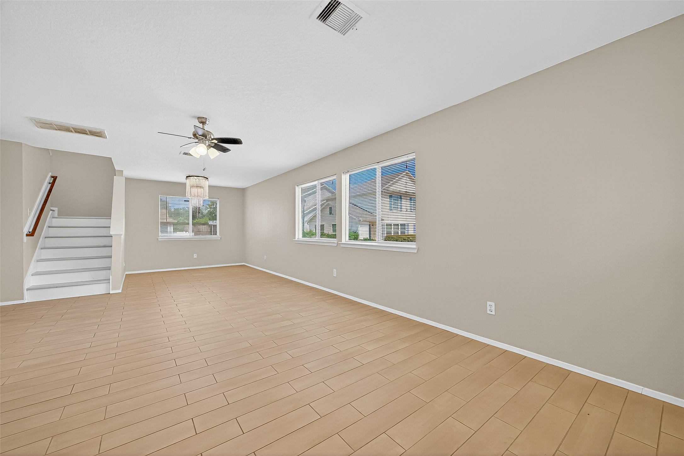 6343 Settlers Square Lane Katy, TX 77449 - Photo 7 of 41 wooden floor in an empty room with a window