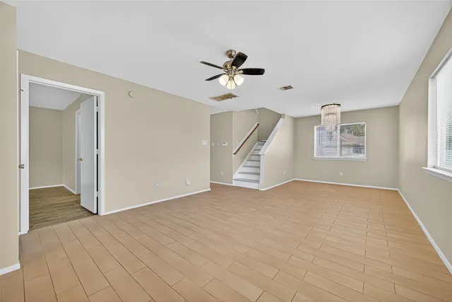 a view of an empty room with a window