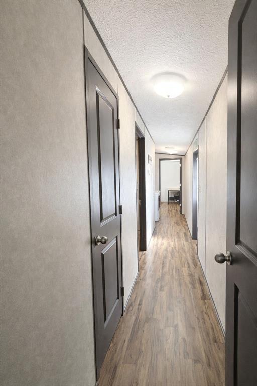 112 Rising Star Quitman, TX 75783 - Photo 13 of 39 a view of a hallway with wooden floor