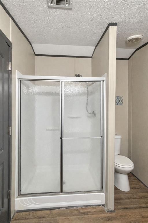 112 Rising Star Quitman, TX 75783 - Photo 19 of 39 a bathroom with a shower and a toilet