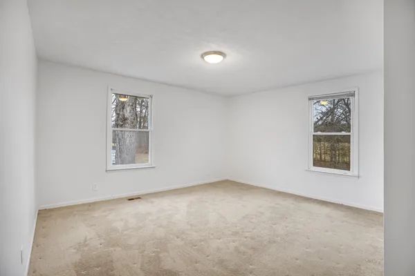 an empty room with windows