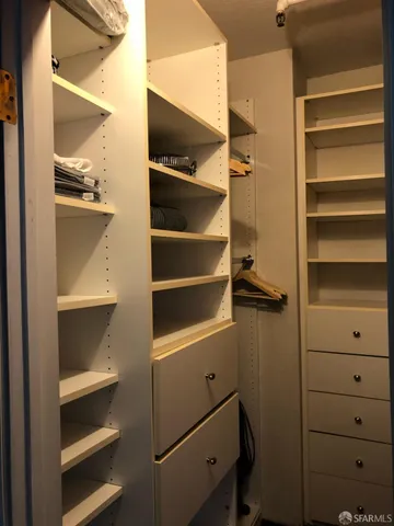 a kitchen with stainless steel appliances granite countertop a stove and a refrigerator