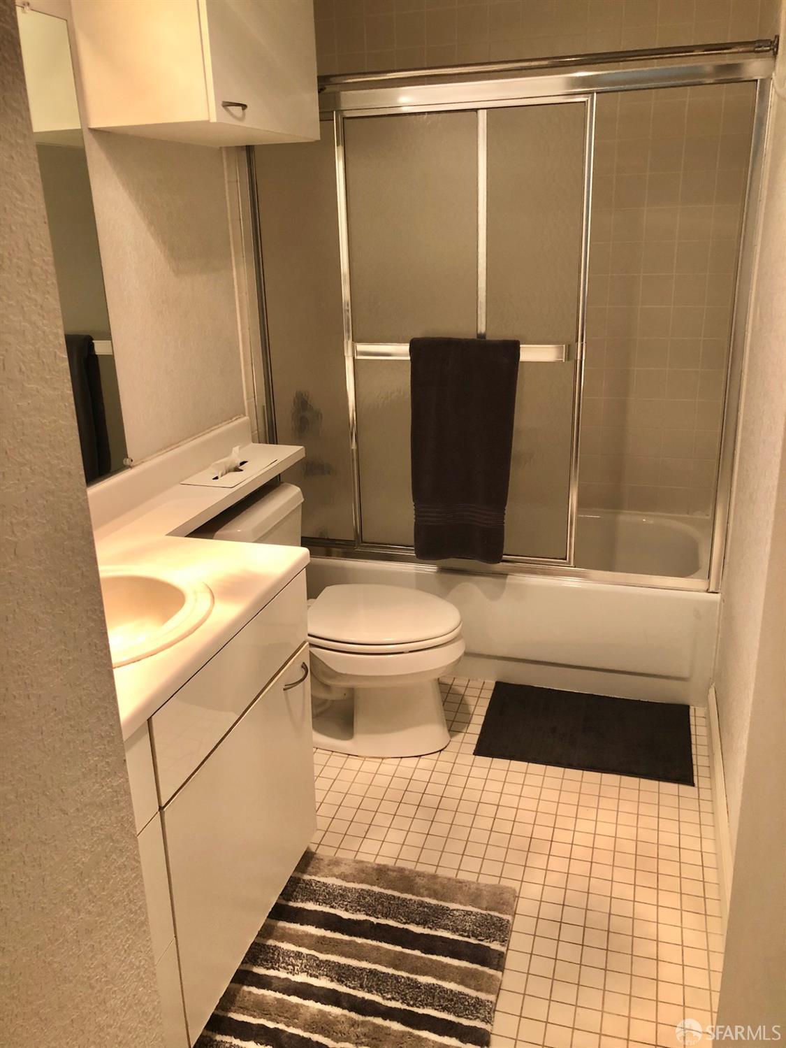 201 Harrison Street, Unit 129 San Francisco, CA 94105 - Photo 5 of 19 a bathroom with a sink toilet and shower