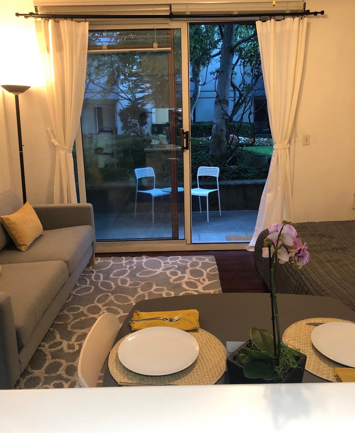 201 Harrison Street, Unit 129 San Francisco, CA 94105 - Photo 8 of 19 a balcony with table and chairs