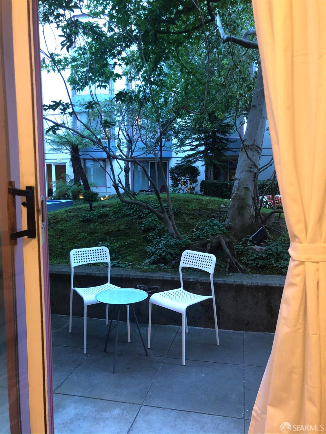201 Harrison Street, Unit 129 San Francisco, CA 94105 - Photo 9 of 19 a view of chair and table in backyard