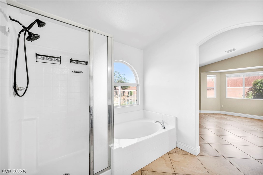 6405 North Raptor Court North Las Vegas, NV 89084 - Photo 39 of 66 Indulge in this bathroom featuring a large soaking tub, separate shower, and tiled flooring.