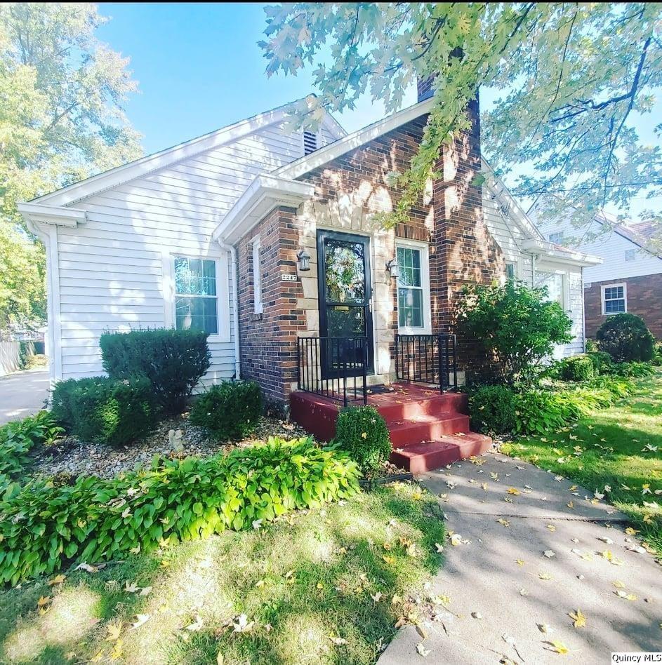 2247 Spring Street Quincy, IL 62301 - Photo 1 of 1 a front view of a house with garden