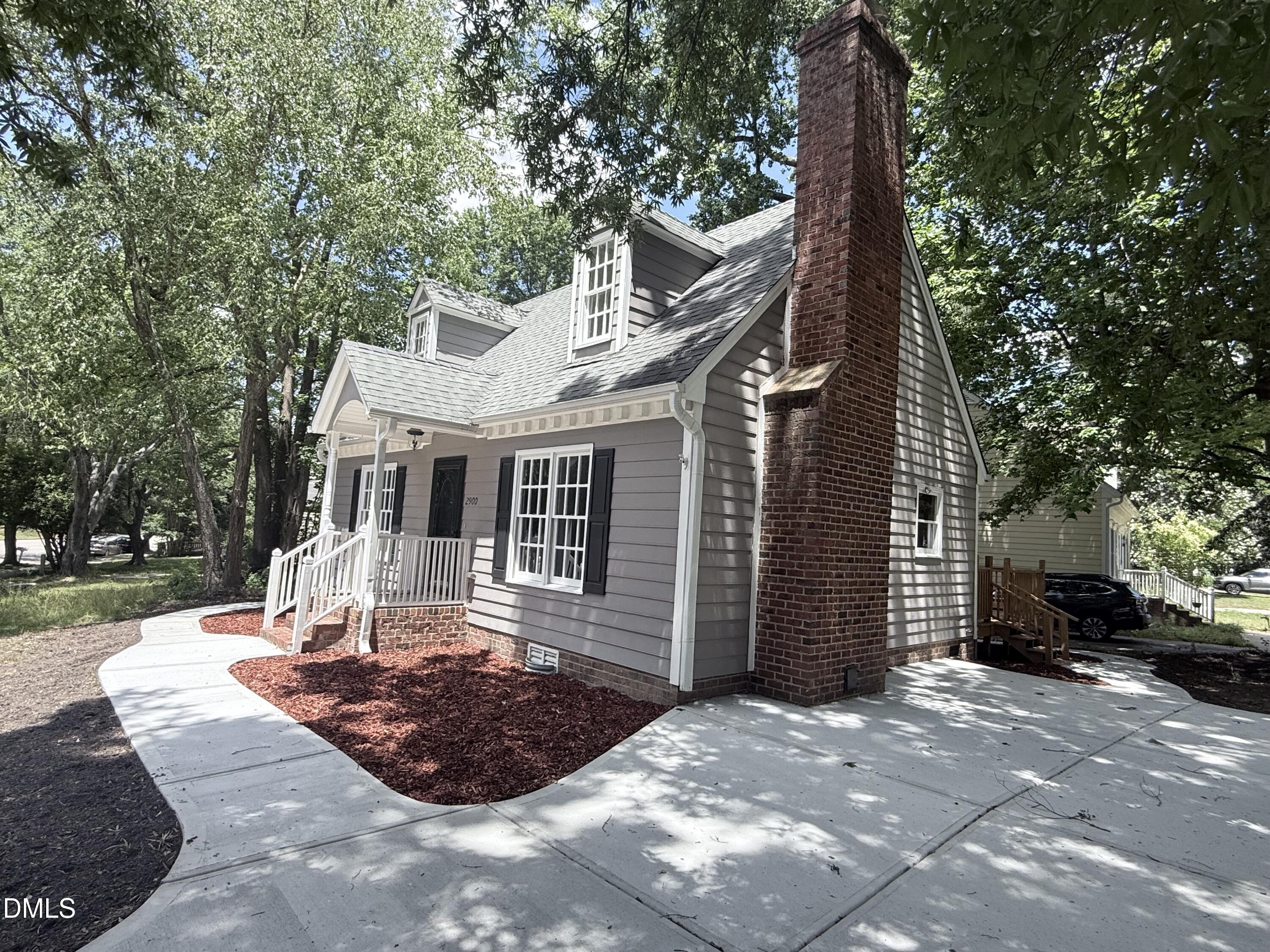 2900 Broadlands Drive Raleigh, NC 27604 - Photo 4 of 60 a front view of a house with a yard