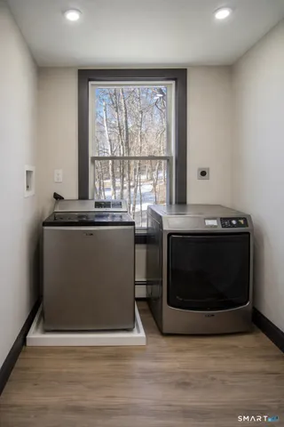 a room with a stove and a microwave
