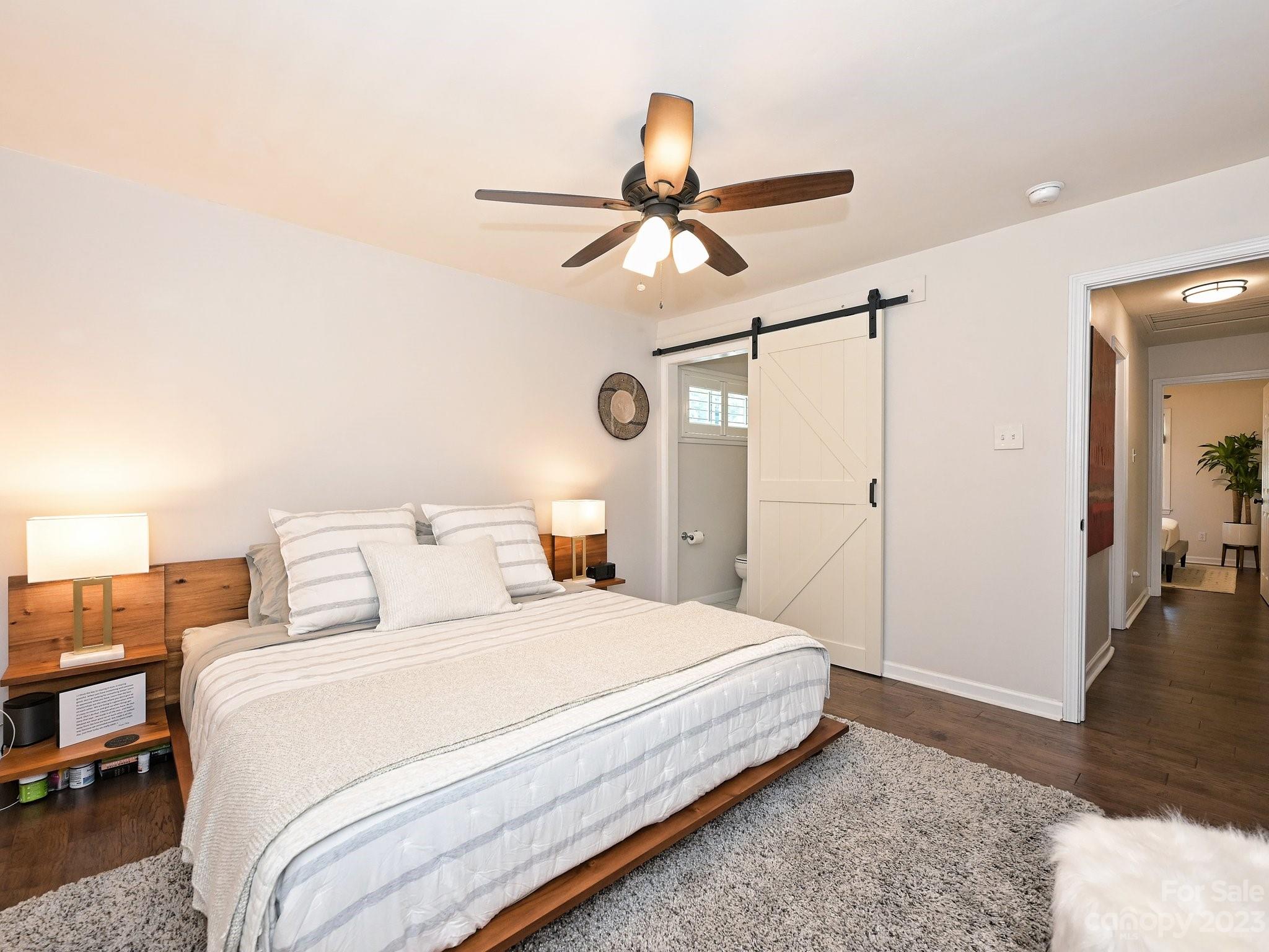 101 Scofield Road Charlotte, NC 28209 - Photo 15 of 26 a bedroom with a bed and a walk in closet